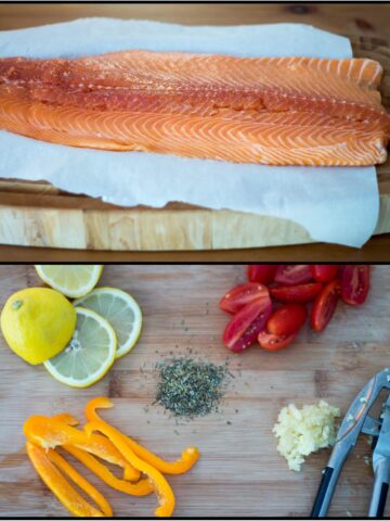 Salmon on cutting board with toppings