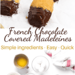 lined up madeleines dipped in chocolate on a white parchemin paper.
