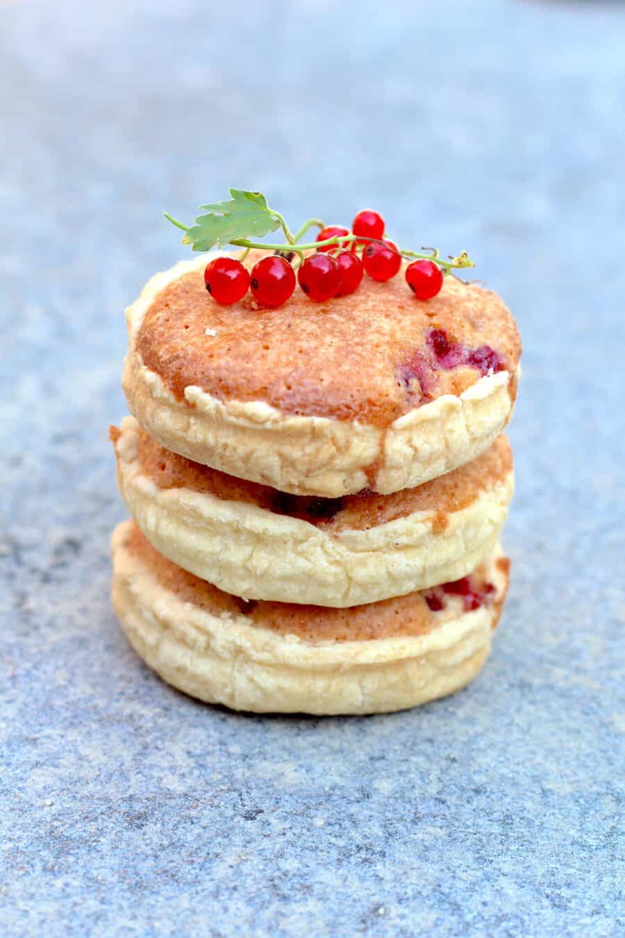 Stack of red currants and almonds mini pies 