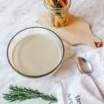 Bowl of French rosemary potato leek soup with bread sticks