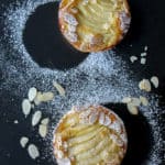 View from above of French tart Amandine: a delicious flaky crust with an almond cream filling and a juicy pear.