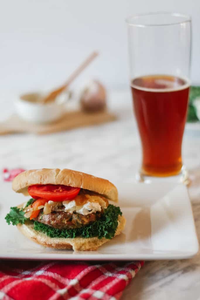 healthier ratatouille turkey burger with an amber beer on the side