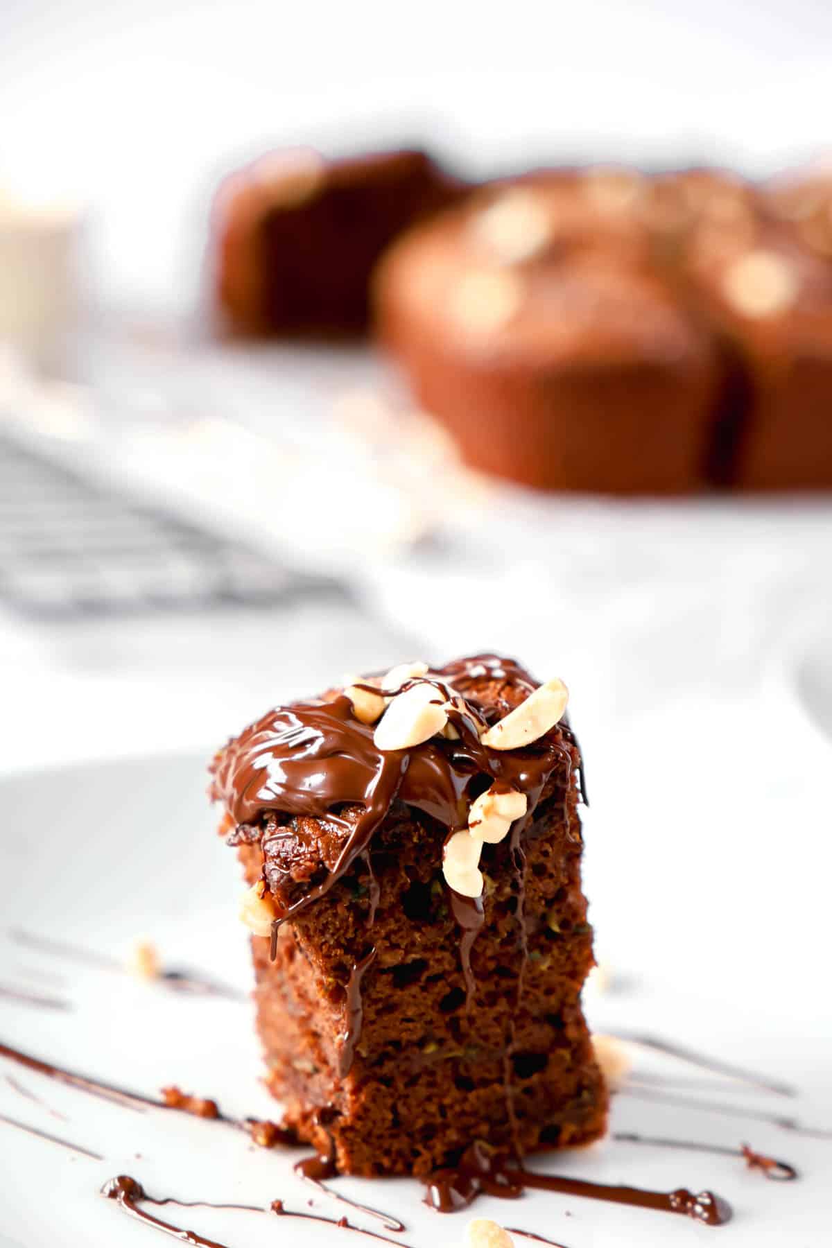 piece of chocolate cake with a drizzle of chocolate on it. 