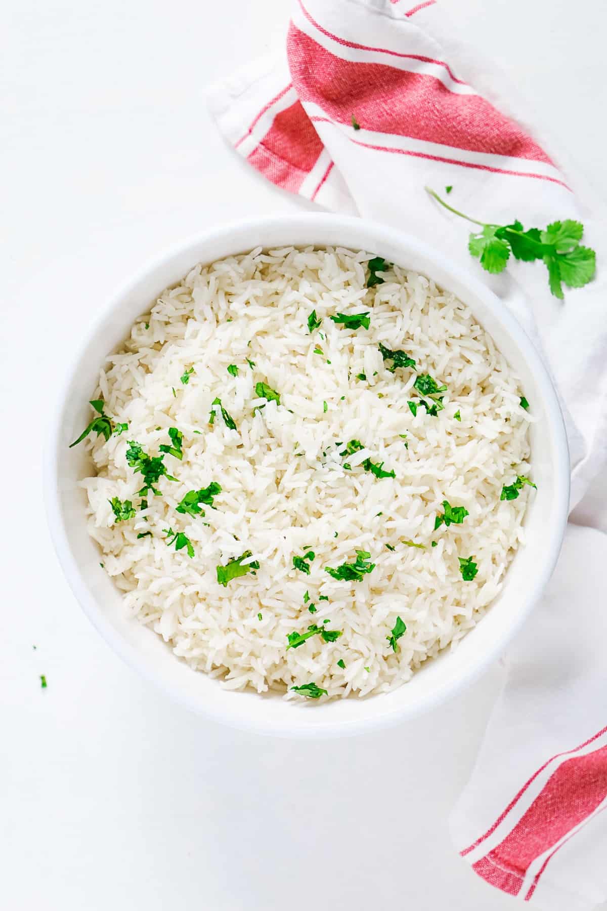 Top view of a bowl of basmati rice with parsley