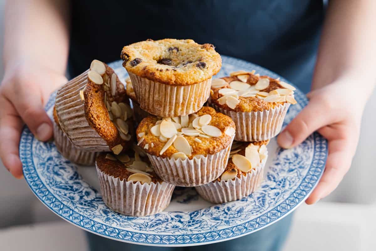 Side view of a blue plate filled with almond flour banana muffins