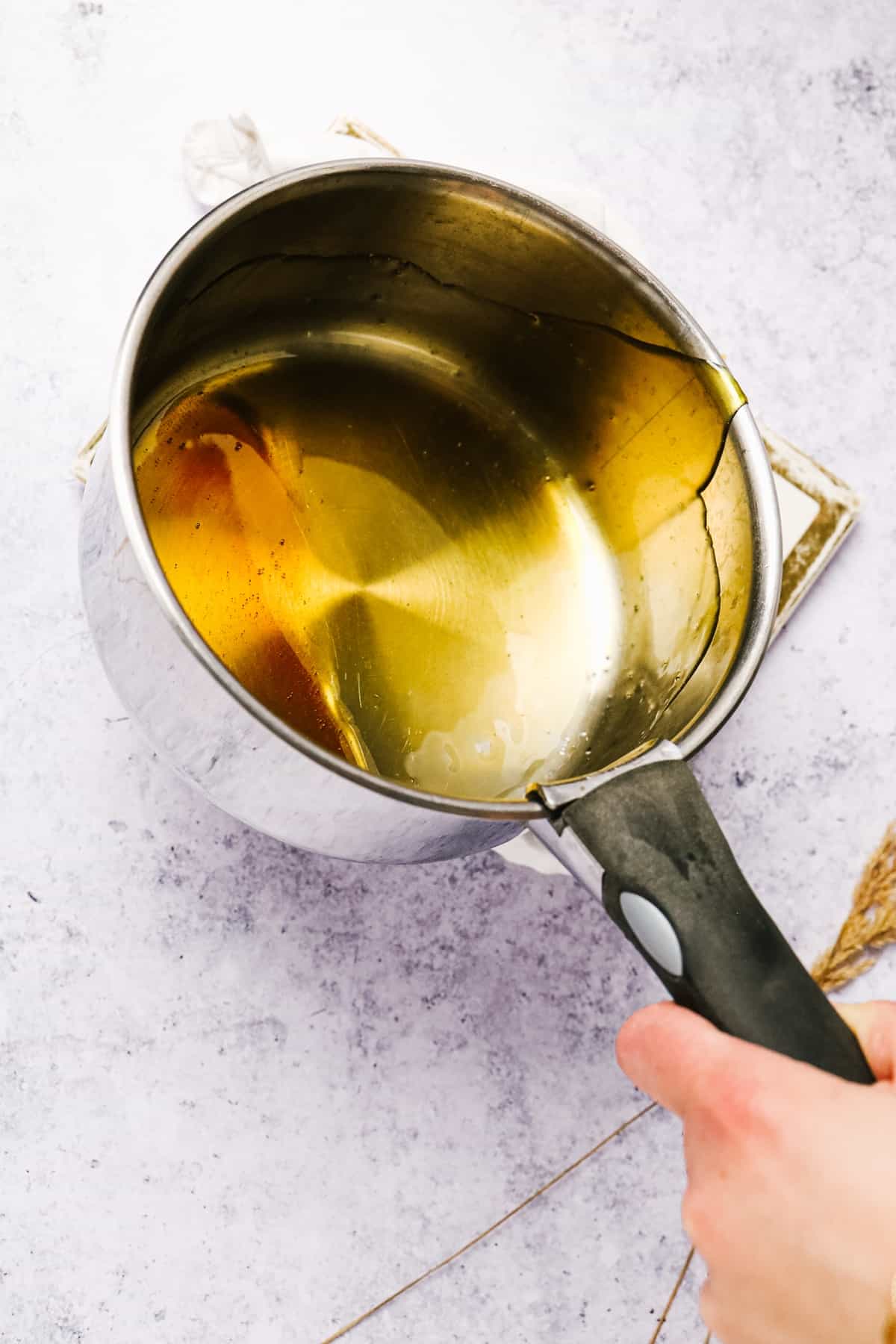 Golden caramel in a silver pot