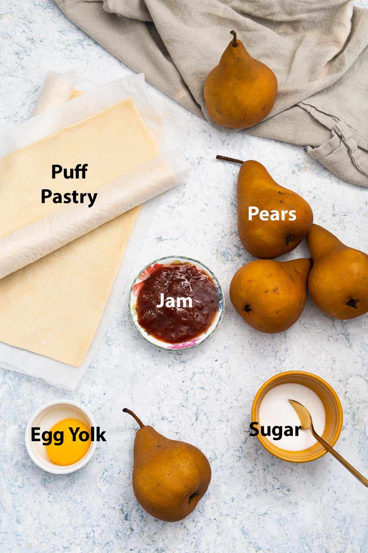 labelled ingredients: puff pastry, pears, jam, egg yolk and sugar.