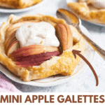 An apple galettes with whipped cream on top, the first one has a spoon on a white plate.