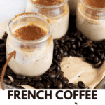 5 glass jars with coffee pot de creme on a tray filled with coffee beans.